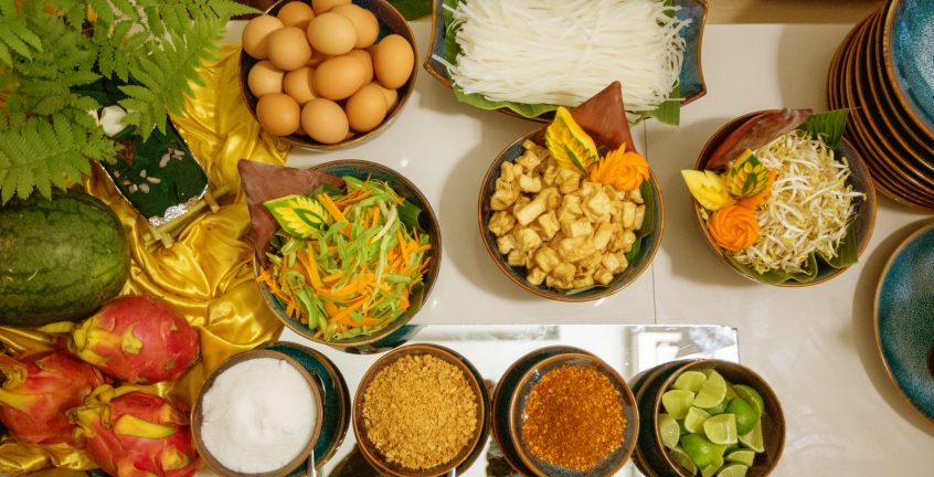Guests cook their first famous Lao dish Papaya salad